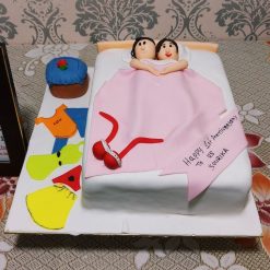 Couple in Bed Anniversary Cake